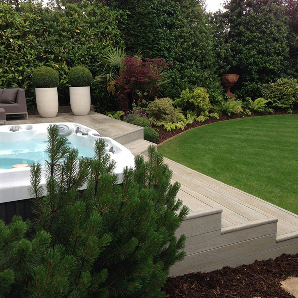 A compact garden plunge pool tucked into a small block
